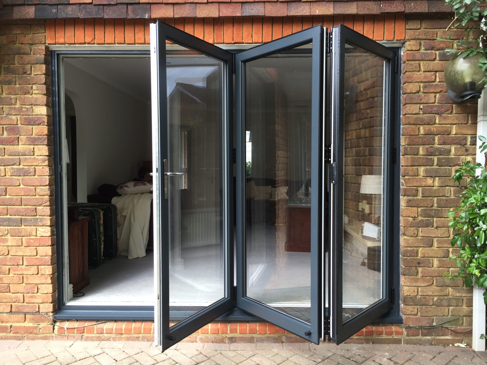 black aluminium bi-fold doors Morden open